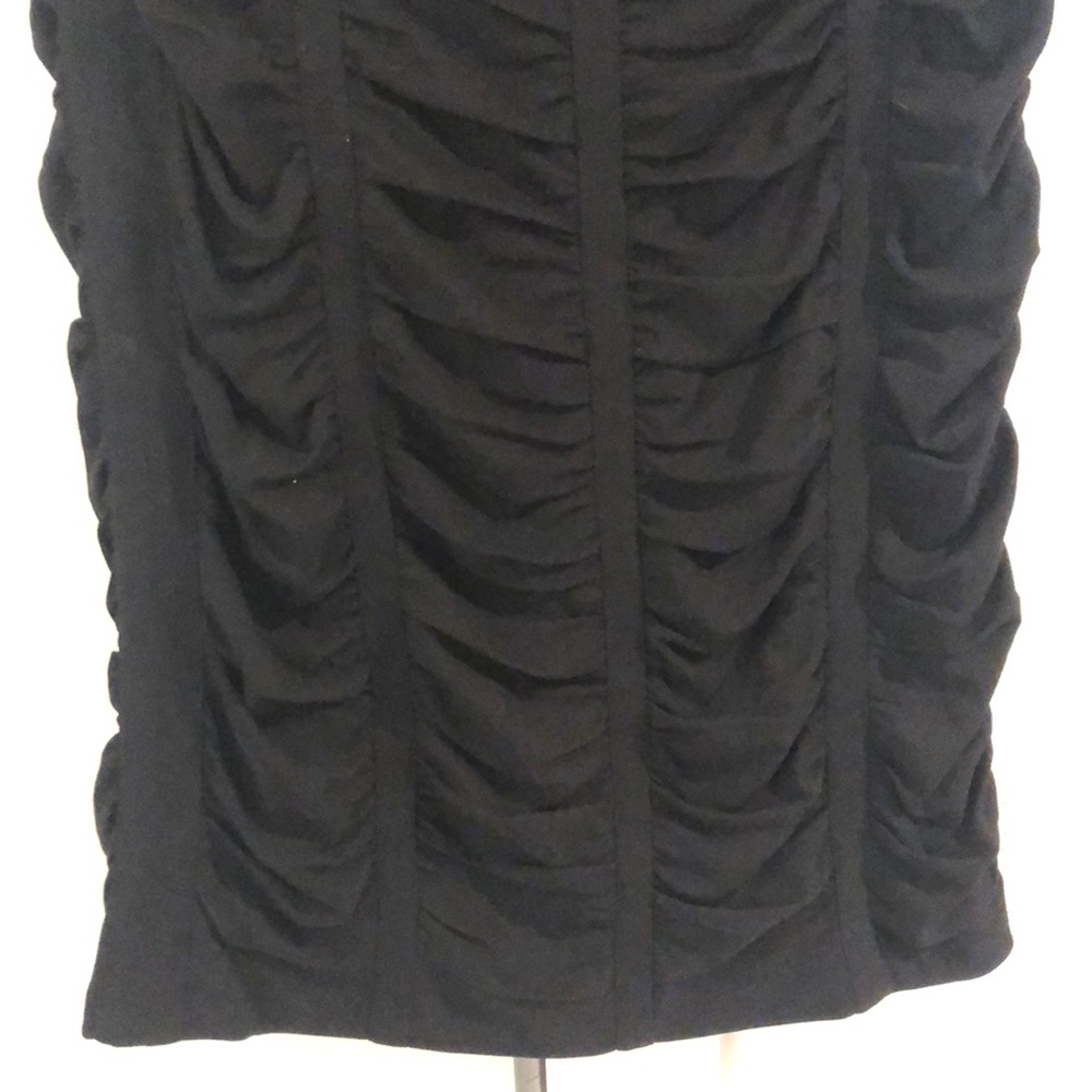 Black mid-length pencil skirt. 100% silk.